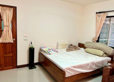 Moderately furnished bedroom with natural light