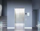 Modern elevator in a sleek building lobby with staircase