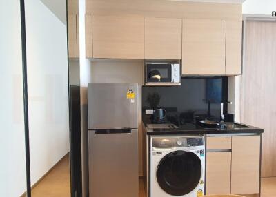 Compact modern kitchen with integrated appliances