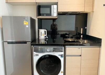 Modern kitchen with integrated appliances at Hampton Residence