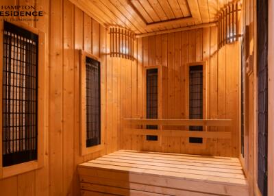 Interior of a spacious wooden sauna with multiple bench seats