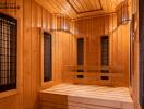 Interior of a spacious wooden sauna with multiple bench seats