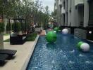 Luxurious outdoor swimming pool area with residential buildings