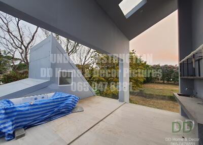 Spacious patio with partial covering and garden view