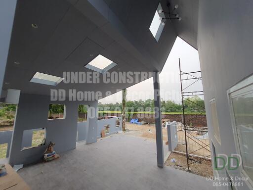 Under construction modern home interior with exposed structure and large windows