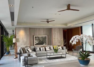 Spacious and modern living room with elegant decor and ample natural light