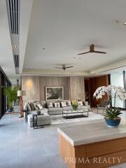 Spacious and modern living room with elegant decor and ample natural light