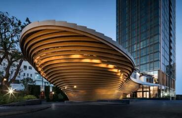 Modern architectural building with dynamic lighting at dusk