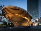 Modern architectural building with dynamic lighting at dusk