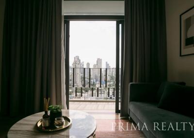 Elegant living room with city view through large balcony doors