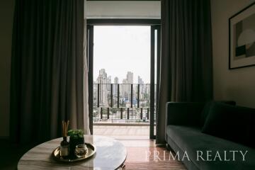 Elegant living room with city view through large balcony doors