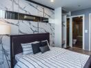 Modern bedroom with elegant marble wall design and stylish furnishings