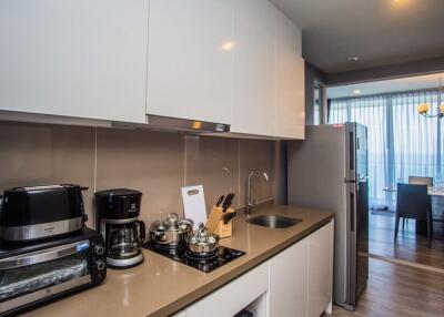 Modern kitchen with appliances and adjacent dining area