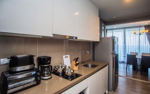 Modern kitchen with appliances and adjacent dining area