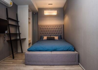 Modern and cozy bedroom with stylish bed and ambient lighting