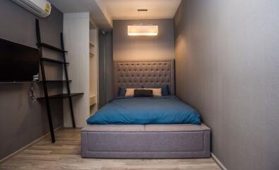 Modern and cozy bedroom with stylish bed and ambient lighting