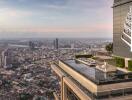 Luxurious rooftop garden overlooking a sprawling cityscape at dusk