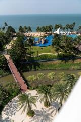 Aerial view of a luxury resort with swimming pool and beachfront