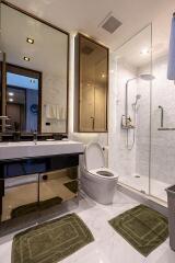 Modern bathroom interior with elegant fixtures and glass shower