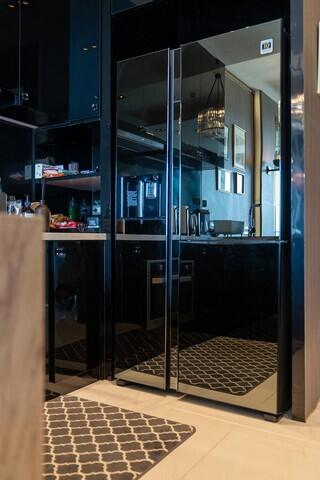Modern kitchen interior with elegant glass doors and designer floor