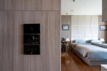 Modern bedroom view from the entrance showing elegant decor and ambient lighting