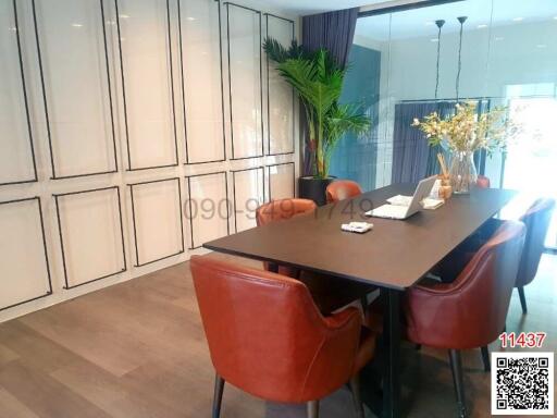 Spacious dining room with large table and stylish interior