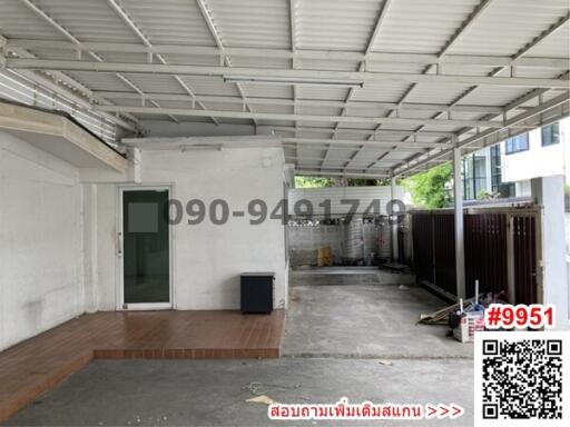 Spacious covered parking or multipurpose area with metal roof and tiled floor