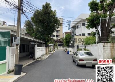 Residential street view with apartments and parked car