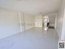 Spacious and bright empty living room with glossy tiled floor