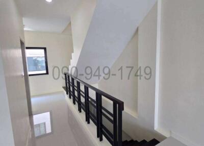 Bright and modern hallway with staircase