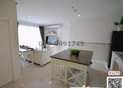 Modern white kitchen with breakfast area