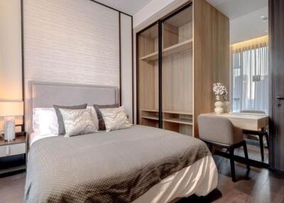 Elegant modern bedroom with integrated wardrobe and seating area