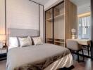 Elegant modern bedroom with integrated wardrobe and seating area