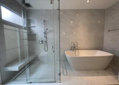 Modern bathroom with freestanding bathtub and glass shower