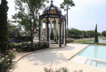 Luxurious garden gazebo next to a pool