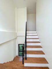 Modern staircase with wooden steps and minimalist design