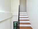 Modern staircase with wooden steps and minimalist design