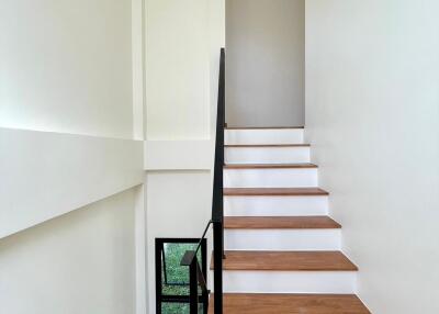 Modern staircase with wooden steps and minimalist design