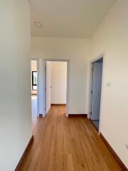 Bright and spacious hallway with wooden flooring