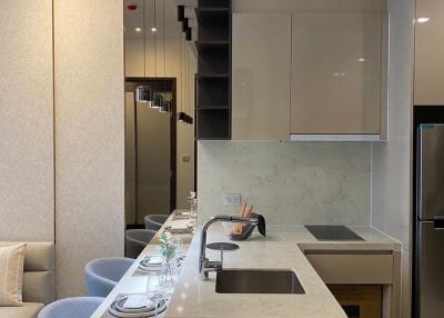 Modern kitchen with integrated appliances and breakfast bar