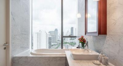 Modern bathroom with marble finishing and city view