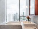 Modern bathroom with marble finishing and city view