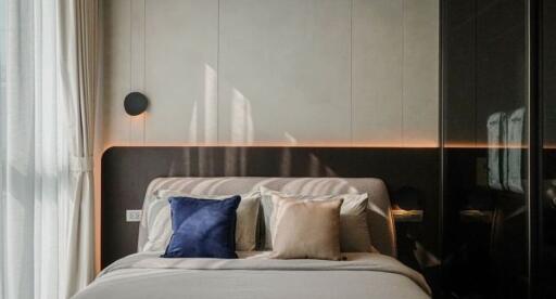 Modern bedroom with elegant decor and ambient lighting