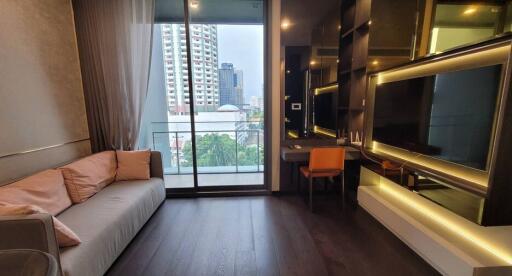 Modern living room with city view through large balcony window