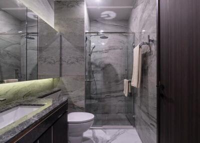 Modern bathroom with marble walls and sleek fixtures