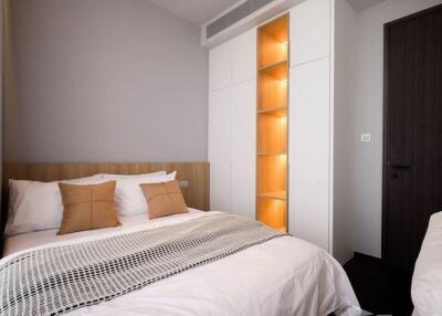 Modern bedroom with double bed and stylish lighting