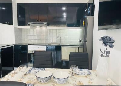 Modern kitchen with fully equipped dining setup