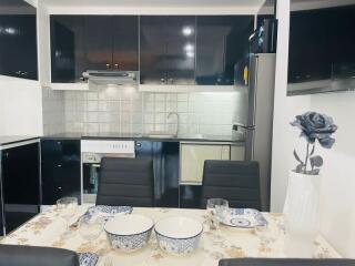 Modern kitchen with fully equipped dining setup