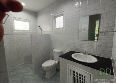 Modern bright bathroom with tiled walls and flooring