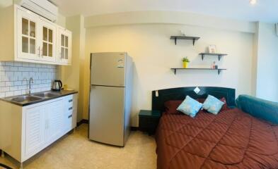 Compact studio apartment with integrated kitchen and sleeping area